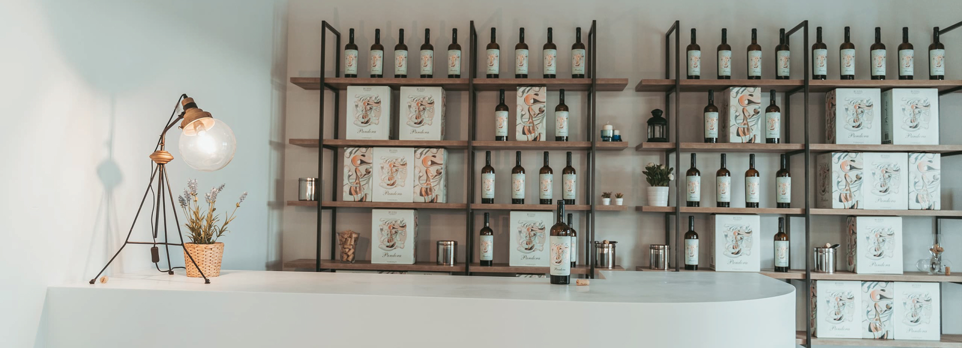 Bottles of Pandra Verdejo behind a tasting bar at the Bodegas Pandora winery in Rueda, Spain.